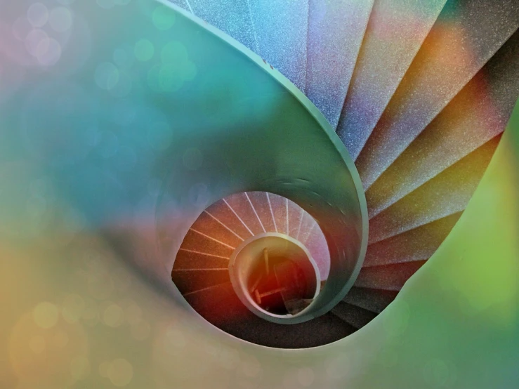a close up of a spiral staircase with a blurry background, a microscopic photo, inspired by Gabriel Dawe, green blue red colors, seashell, pastell colours, penrose stairs