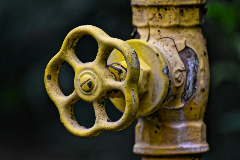 a close up of a yellow fire hydrant, a picture, by Stefan Gierowski, renaissance, broken machinery, close-up product photo, pipe, closeup photo