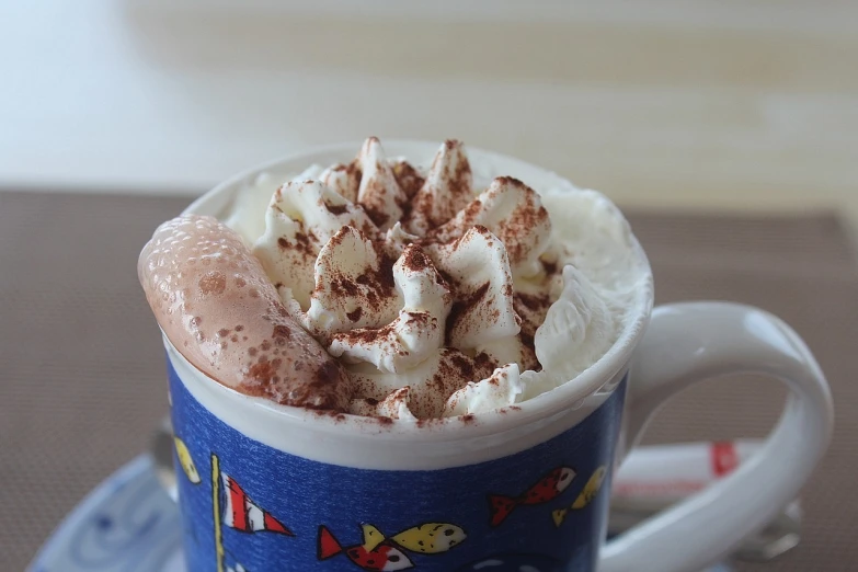 a cup of hot chocolate with whipped cream and chocolate sprinkles, tumblr, arabesque, shark, draft, shell, close - up