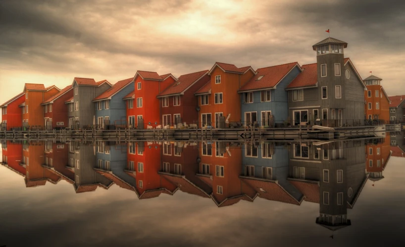 a row of houses next to a body of water, a picture, by Erik Pevernagie, pexels contest winner, photorealism, red orange blue beige, beautiful rtx reflections, dutch, selective color effect