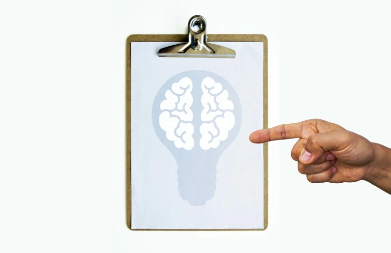 a clipboard with a drawing of a light bulb, by Julian Allen, conceptual art, miniature human brain, finger, with a white background, paper cutout