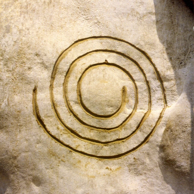 a stone sculpture with a spiral design on it, a cave painting, land art, 1 9 9 6, sundial, ancient city of white stone, whirlpool