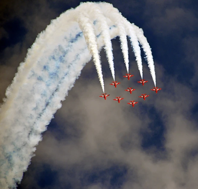 a group of jets flying through a cloudy sky, by Dave Allsop, curved red arrow, prize winning, fire above head, female ascending