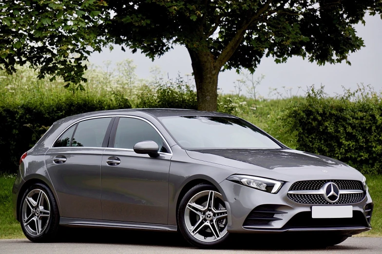 a silver car parked on the side of the road, by Jay Hambidge, pixabay, mercedez benz, modern minimalist f 2 0, elegant asymmetrical, gun metal grey