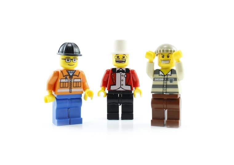 a couple of lego men standing next to each other, by senior artist, high detail product photo, trio, working clothes, on white background
