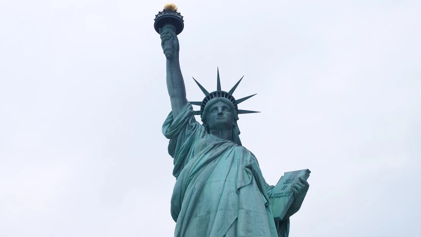 a close up of a statue of liberty on a cloudy day, a statue, art nouveau, usa-sep 20, 🦩🪐🐞👩🏻🦳, tourist photo, sidney lugo