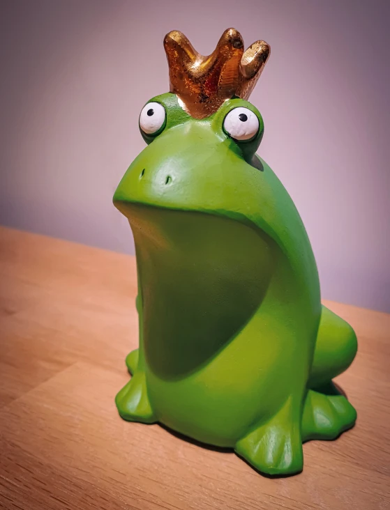 a green frog with a gold crown on its head, inspired by Ron English, new sculpture, 🐿🍸🍋, nicolas cage mossy statue, moomin, looking upward