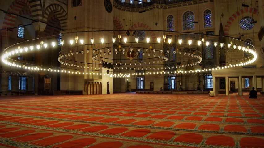 a large room with a chandelier in the middle of it, hurufiyya, carpet, many lights, istanbul, floor b2