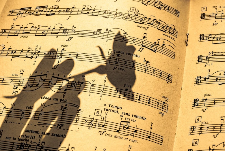 a shadow of a person on a sheet of music, by Svetlin Velinov, shutterstock, romanticism, kiss, warm sunshine, diabolus in musica, harmony of butterfly