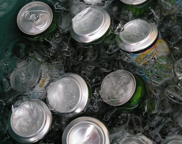 a green bin filled with lots of empty soda cans, a picture, by Jon Coffelt, pexels, process art, transparent water, silver light, water-cooled, slush))