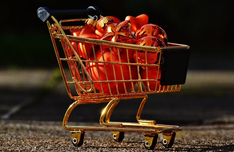 a shopping cart filled with tomatoes sitting on the ground, a photo, pixabay, hyperrealism, shiny gold, giving gifts to people, shining gold and black and red, clean image