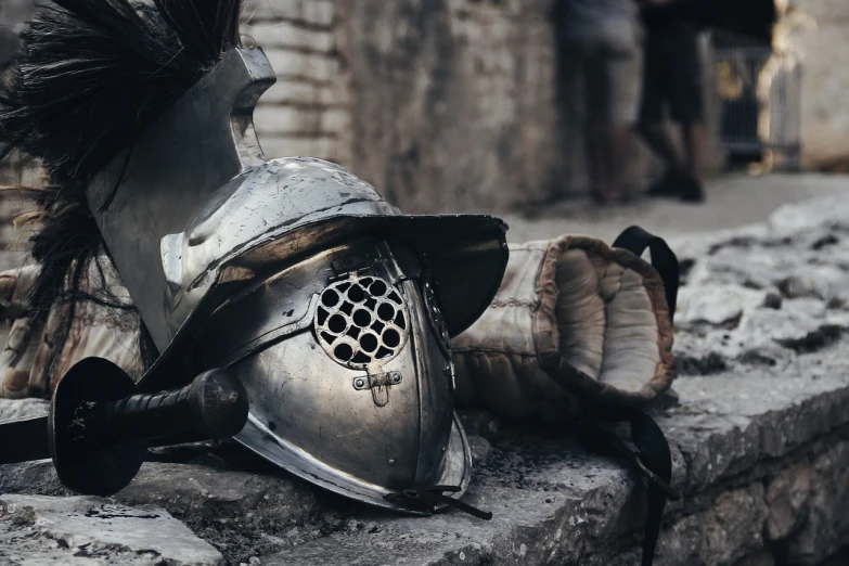 a helmet sitting on top of a stone wall, pexels contest winner, renaissance, dirty armor, getting ready to fight, silver, resting after a hard fight