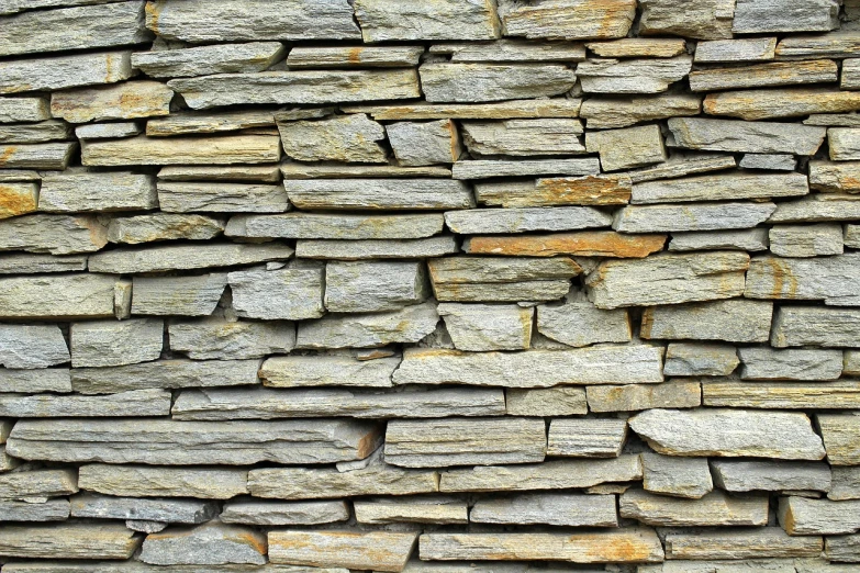 a close up of a stone wall with a fire hydrant, by Hans Fischer, shutterstock, minimalism, stylized stone cladding texture, slate, many golden layers, folded