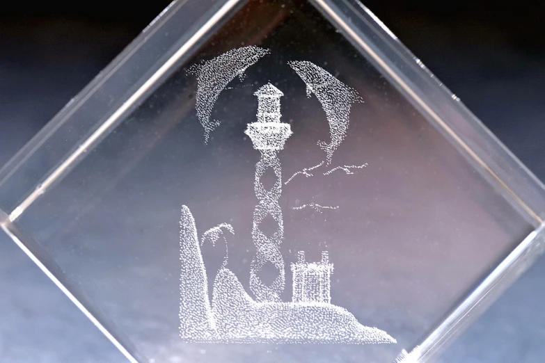 a clear diamond with a picture of a lighthouse on it, an etching, cubic crystals, carving, shark, sigma 1/6