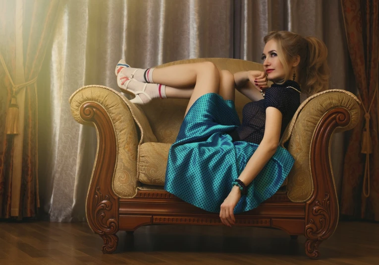 a woman in a blue dress sitting on a chair, inspired by Gil Elvgren, trending on pixabay, fantastic realism, lounging on expensive sofa, ukrainian girl, teal skirt, high shoes