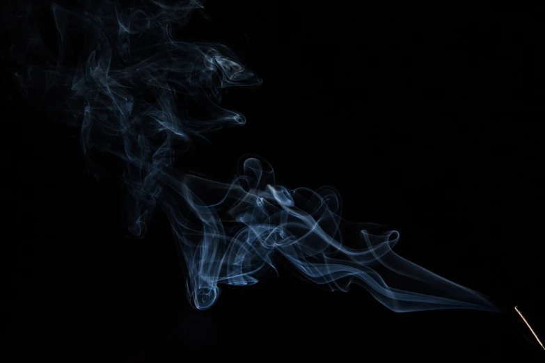 a close up of smoke on a black background, trailing white vapor, diffuse outline, smog on the floor, blue haze