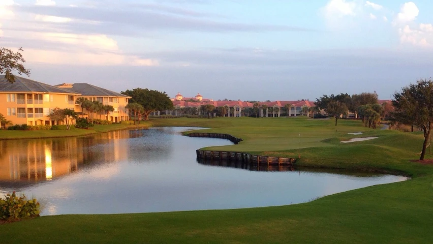 a golf course with a lake in the foreground, by Samuel Scott, cg society contest winner, renaissance, sun coast, early evening, beautiful magical palm beach, house