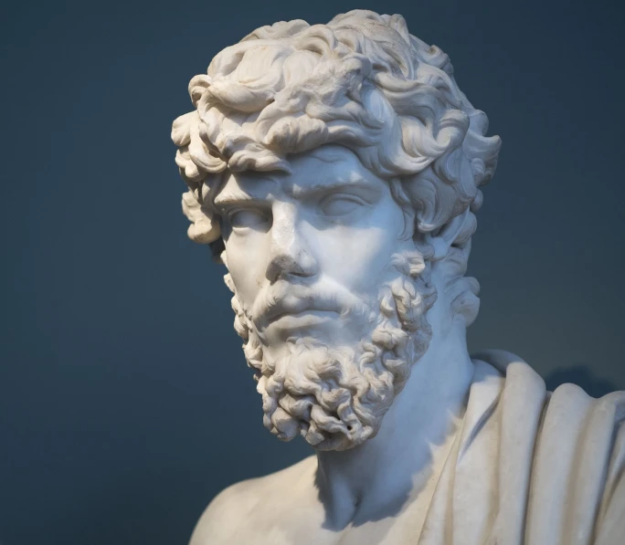 a statue of a man with a beard, a marble sculpture, shutterstock, neoclassicism, highly detailed head, stock photo, graceful gaze, on display in a museum
