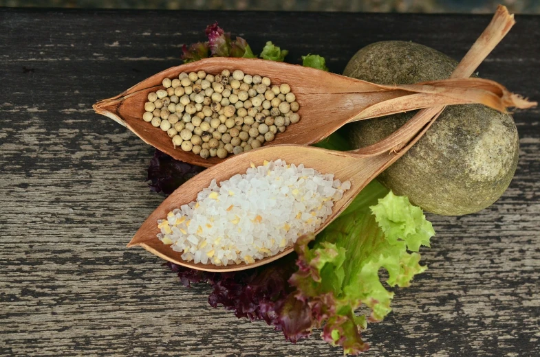 a couple of wooden spoons sitting on top of a table, a photo, pixabay, renaissance, luscious with sesame seeds, salad and white colors in scheme, a salt&pepper goatee, with vegetation