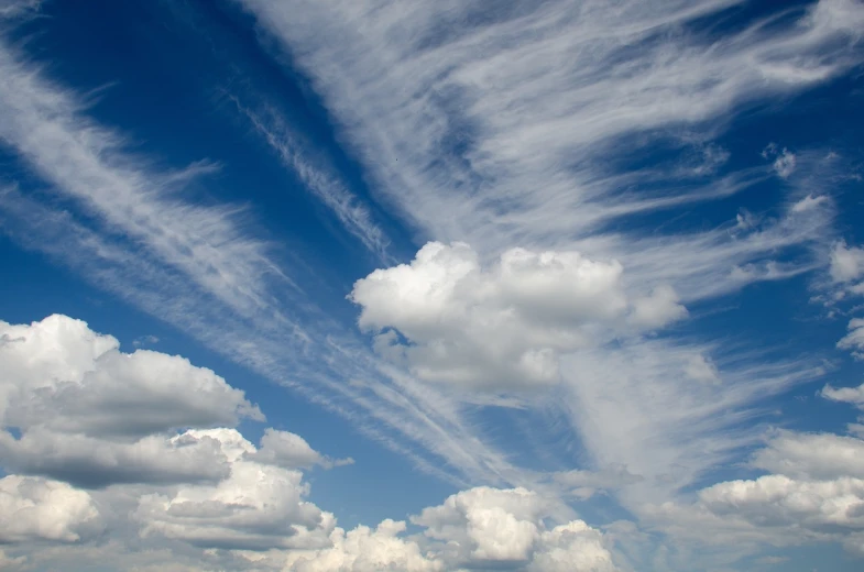 a bunch of clouds that are in the sky, by Hans Schwarz, shutterstock, romanticism, !!natural beauty!!, harmony of swirly clouds, bright summer day, trailing white vapor