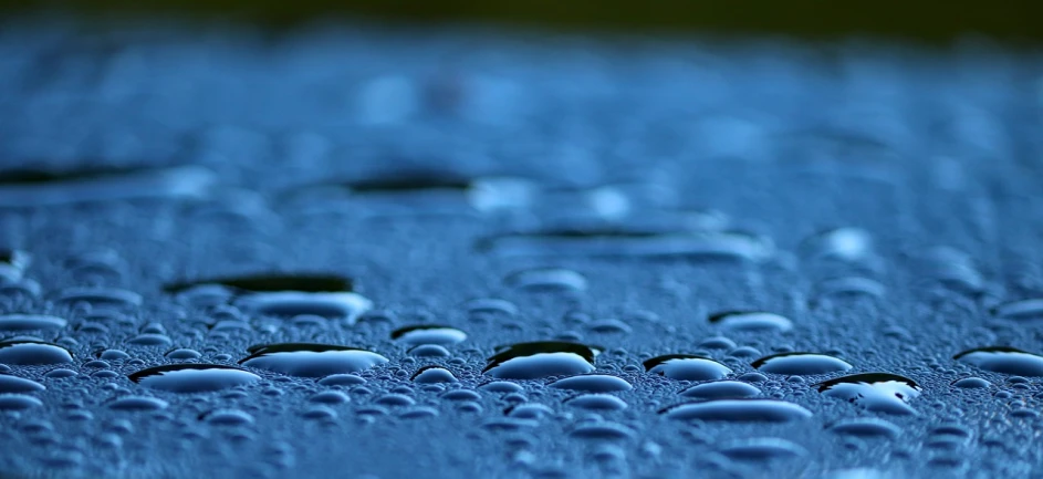 a close up of water droplets on a surface, by Jan Rustem, minimalism, ultra hd wallpaper, blue atmosphere, early morning lighting, mobile wallpaper