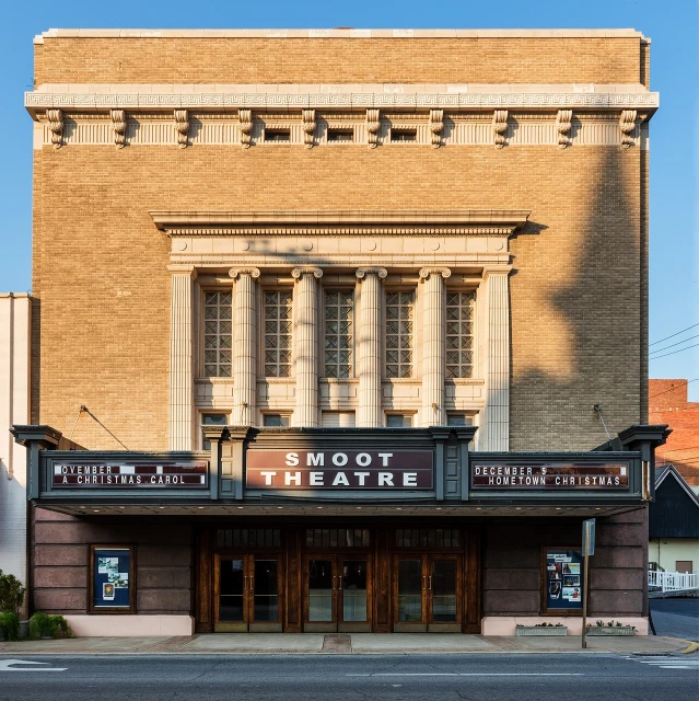 a red fire hydrant sitting in front of a theater, a portrait, by Scott M. Fischer, wide angle exterior 2022, moor, brad, broadway