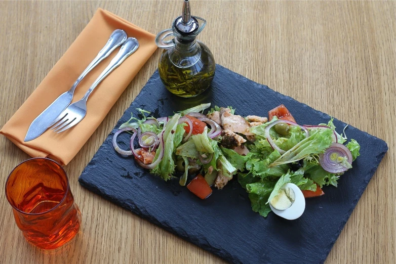 a close up of a plate of food on a table, a digital rendering, pixabay, realism, salad, slate, traditional corsican, un restaurant avec une terrasse