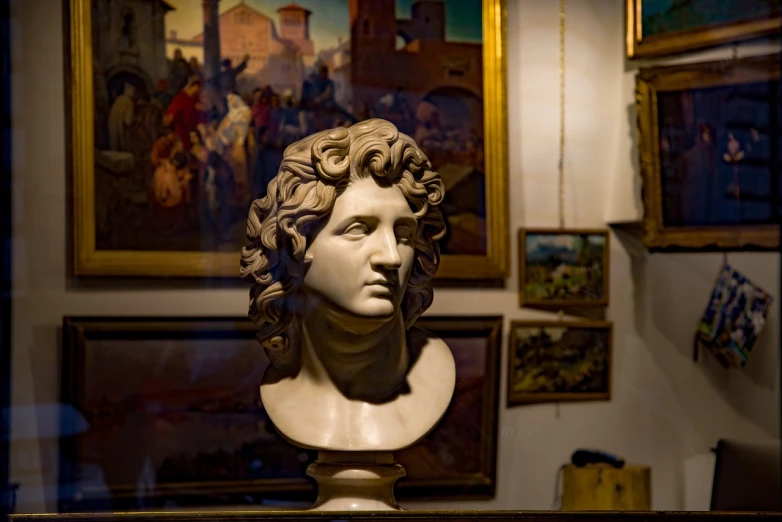 a bust of a man on display in a museum, inspired by Romano Vio, shutterstock, vibrant scene, antiques, portrait”