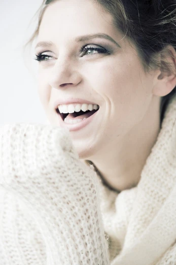 a close up of a person wearing a sweater, by Karl Buesgen, fine art, big smile on her face, a beautiful woman in white, high key, porcelain