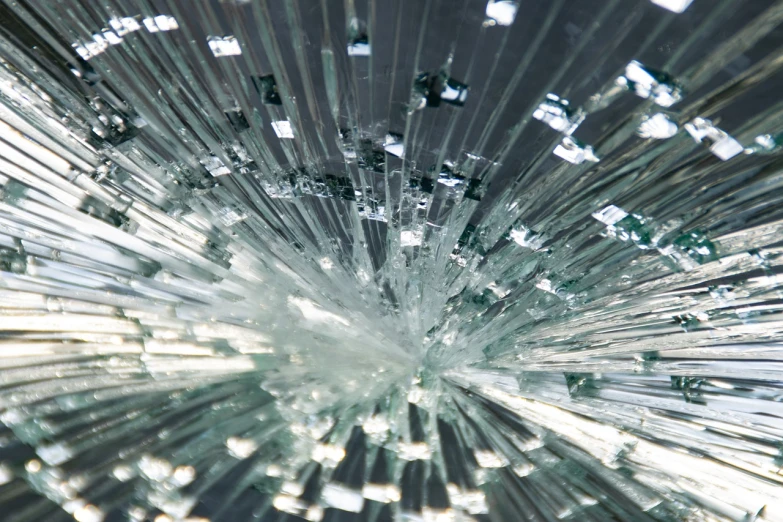 a close up of a broken glass window, a microscopic photo, explosion of light, modern very sharp photo