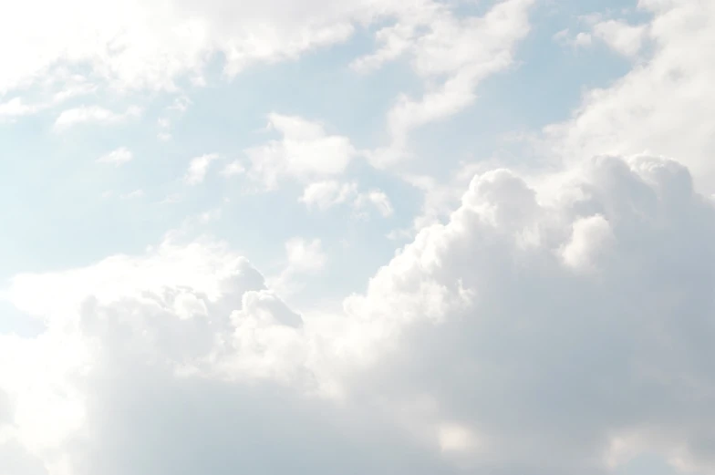 a person is flying a kite in the sky, by Tadashige Ono, minimalism, among heavenly sunlit clouds, white and pale blue, full image