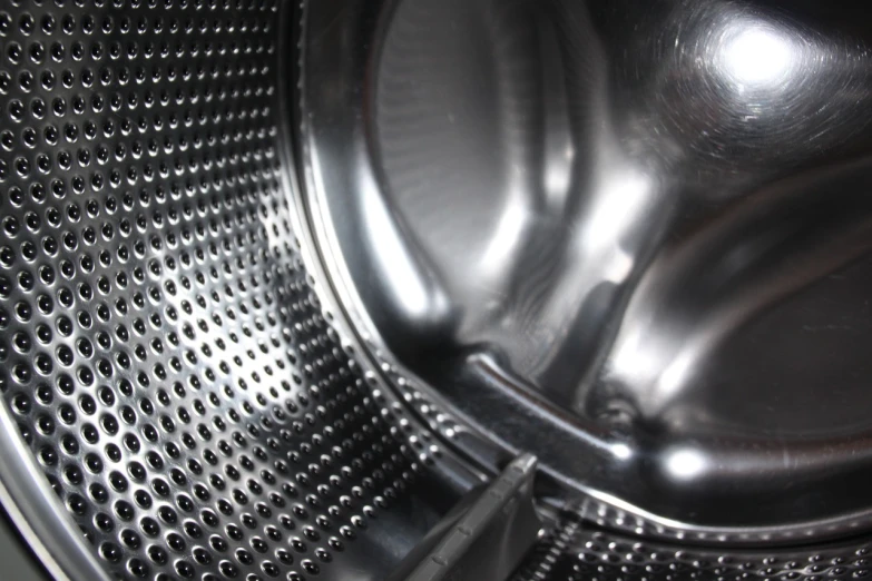 a close up of the inside of a washing machine, a stipple, shutterstock, bauhaus, liquid polished metal, modern very sharp photo