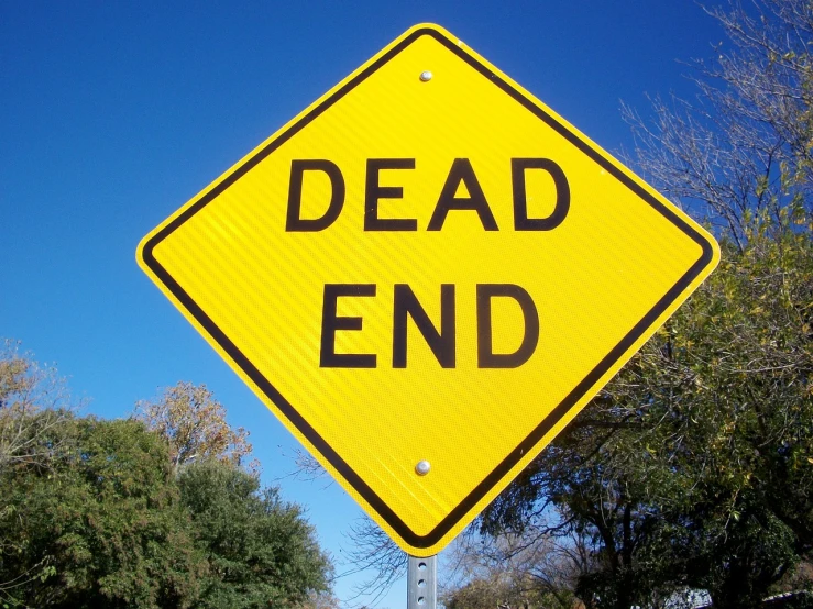 a yellow dead end sign sitting on the side of a road, by David Eugene Henry, flickr, dada, realistic”, highend, goodnight, skull