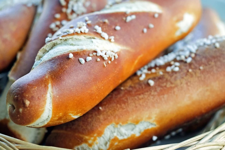 a basket filled with hot dogs covered in sesame sprinkles, by Franz Hegi, pexels, art nouveau, morning detail, brown bread with sliced salo, closeup - view, orthodox