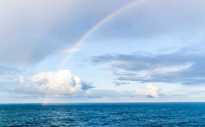 a rainbow in the sky over a body of water, romanticism, open ocean, courtesy of mbari, michael bair, dichromatism