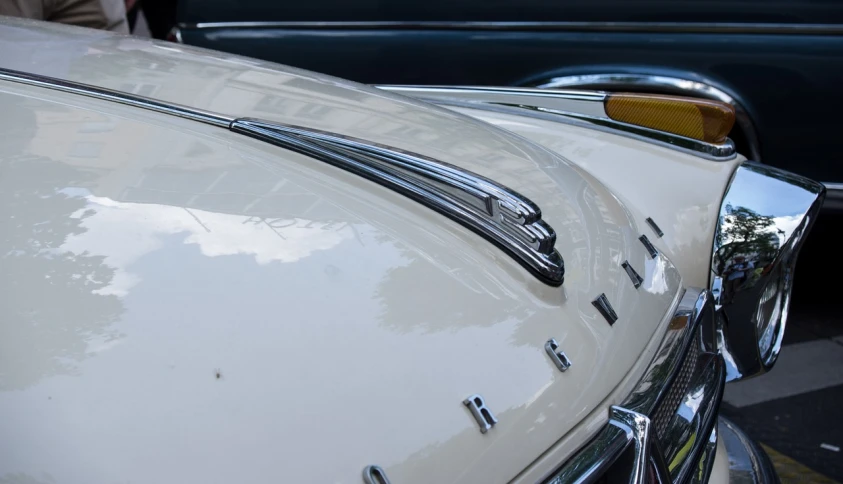 a close up of the hood of a car, by Etienne Delessert, iso 4 0 0, soft top, iso400, shot with sigma f/ 4.2