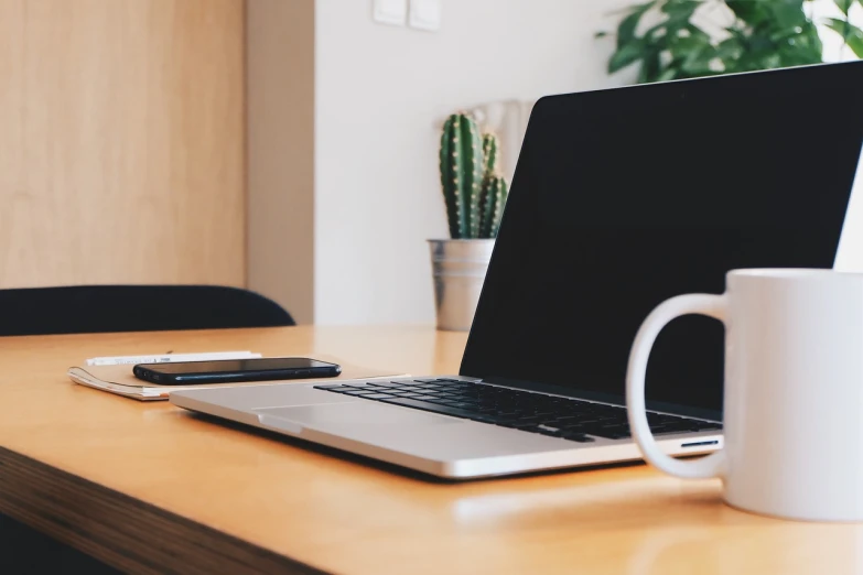 a laptop computer sitting on top of a wooden desk, pexels, realism, ready for a meeting, home office interior, no text!, detail shot