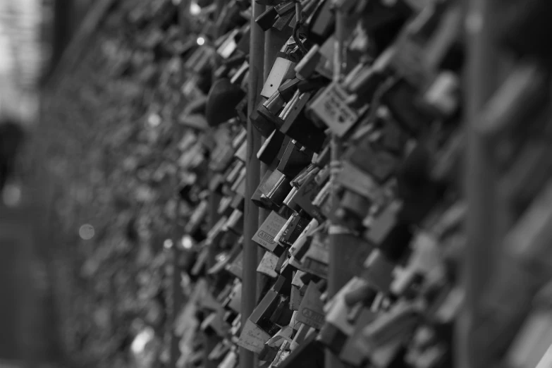 a bunch of locks attached to a fence, by Matthias Weischer, precisionism, 4k greyscale hd photography, tokio, a wooden, shelf