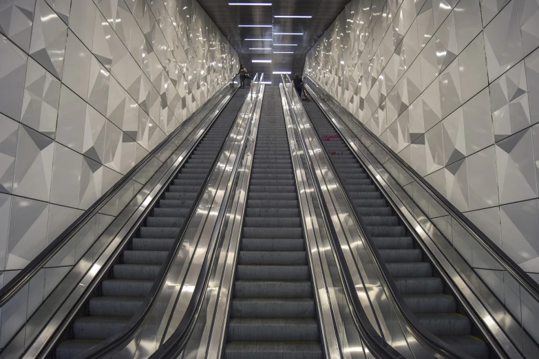 a couple of escalators that are next to each other, by karlkka, flickr, ground level view, stock photo
