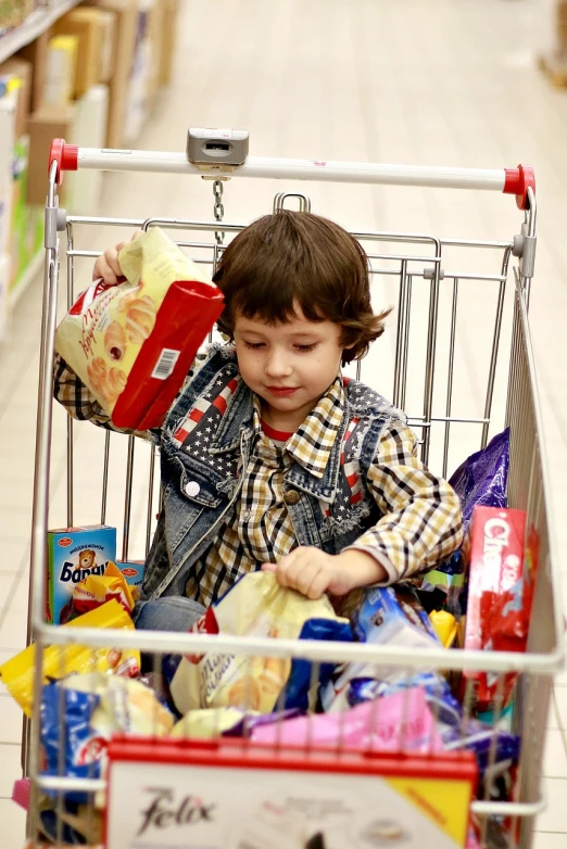 a little boy that is sitting in a shopping cart, a picture, by Arthur Sarkissian, snacks, square, video, 4 0 9 6