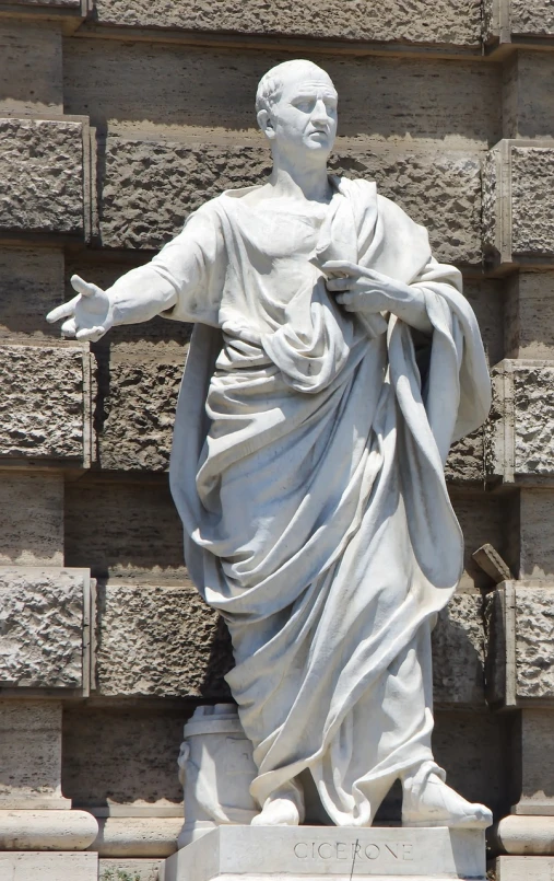 a statue of a man standing in front of a building, a statue, inspired by Cagnaccio di San Pietro, neoclassicism, waving robe movement, beautiful flowing fabric, wearing a flowing dress, christ the redeemer