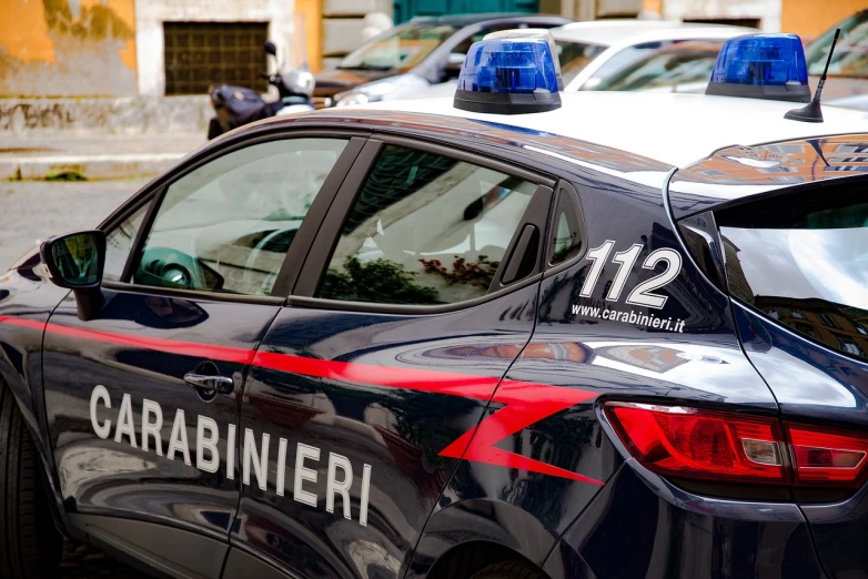 a couple of police cars parked next to each other, a stock photo, by Francesco Raibolini, shutterstock, dada, detail on scene, naples, a24, corner