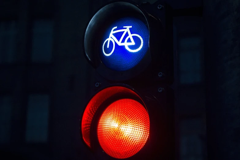 a traffic light with a bicycle sign on it, by Jan Rustem, unsplash, blue and red glowing lights, 4 8 0 p, getty images, 480p