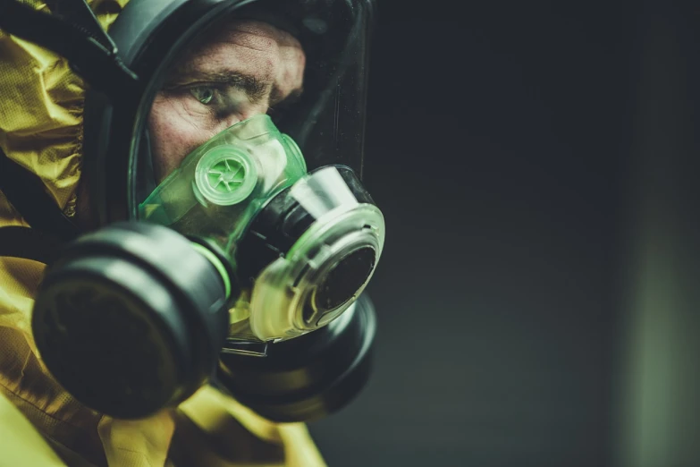 a close up of a person wearing a gas mask, a portrait, shutterstock, nuclear art, walter white action figure, hastur, 4k still, staff wearing hazmat suits