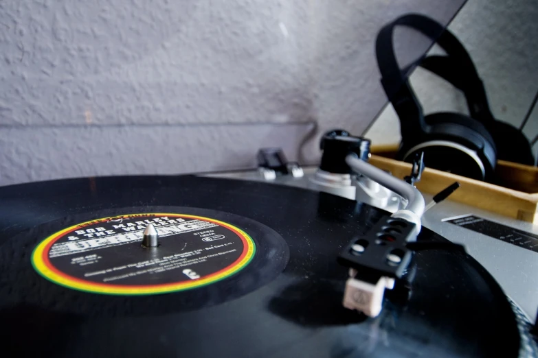 a record sitting on top of a table next to headphones, by Jay Hambidge, jamaican vibe, taken with my nikon d 3, reggae, blog-photo