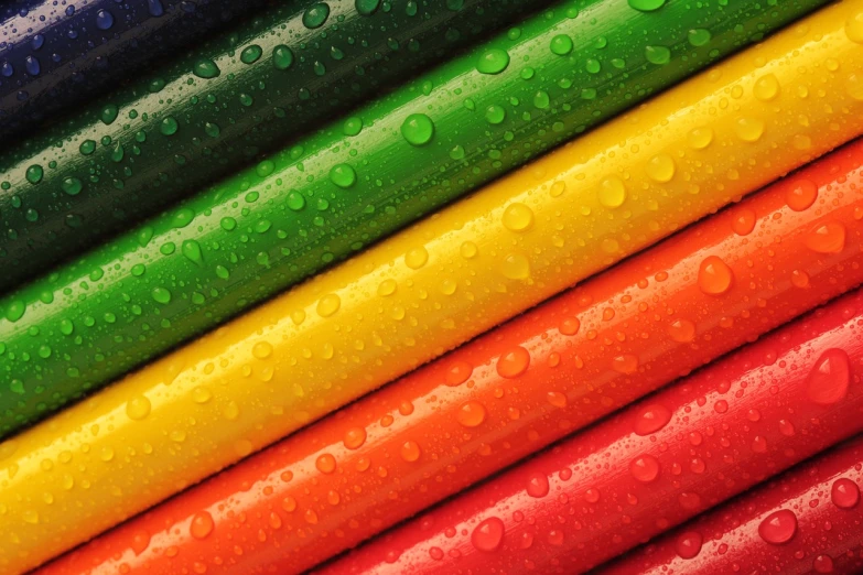 a close up of a rainbow colored background, a picture, by Yi Jaegwan, pexels, crayon art, hoses, beautiful iphone wallpaper, red green yellow color scheme, raindrops