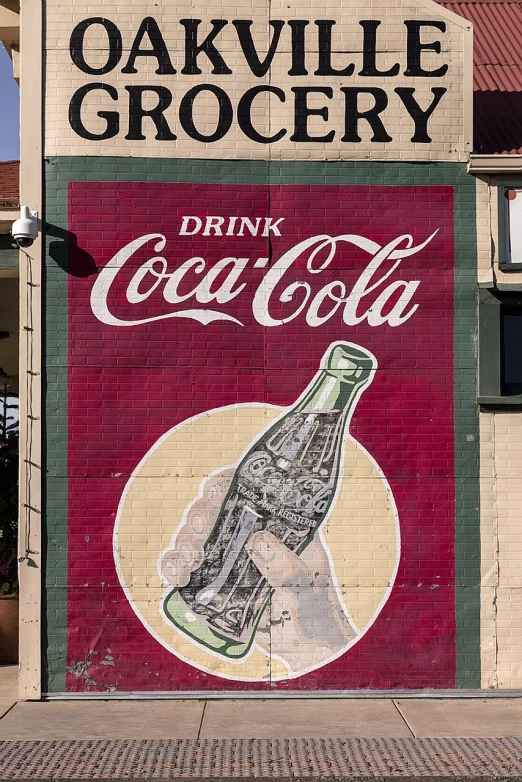 a coca cola advertisement painted on the side of a building, chalk art, by Craola, sf, shot with sony alpha, glossy old advertising poster, ebay photo