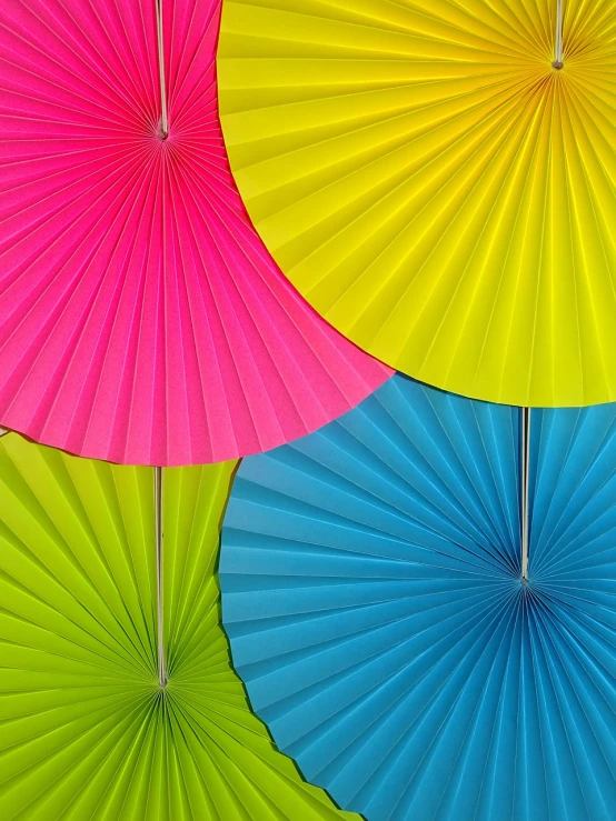 a close up of a bunch of colorful umbrellas, a stock photo, paper decoration, vibrant backlit, three colors, fans hals