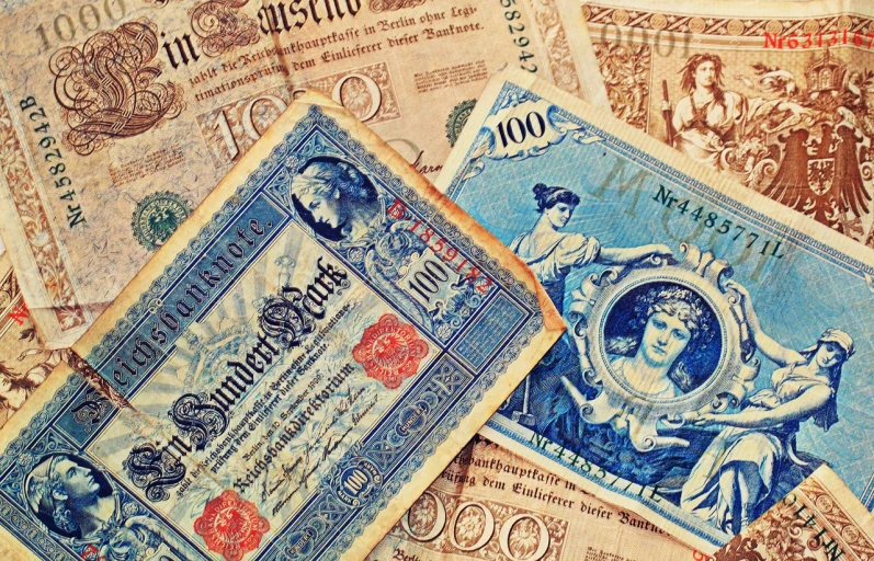 a couple of old bank notes laying on top of each other, by Konrad Witz, trending on pixabay, art nouveau, ebay photo, vintage color, wallpaper - 1 0 2 4, stockphoto