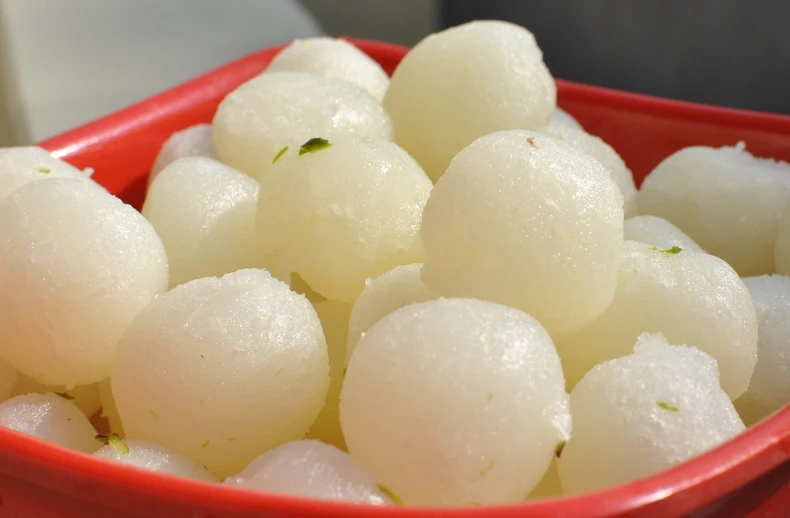 a red bowl filled with white balls of food, dau-al-set, white mist, indore, puffballs, jelly - like texture